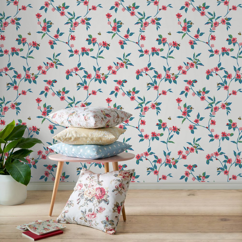 Cath Kidston Greenwich Flowers wallpaper with matching cushions and notepads.