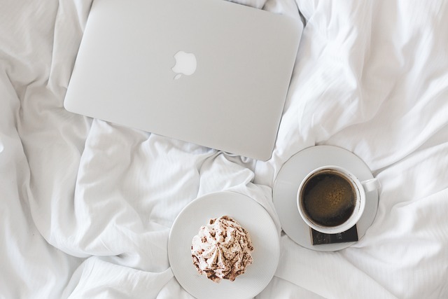 breakfast in bed with coffee and a muffin
