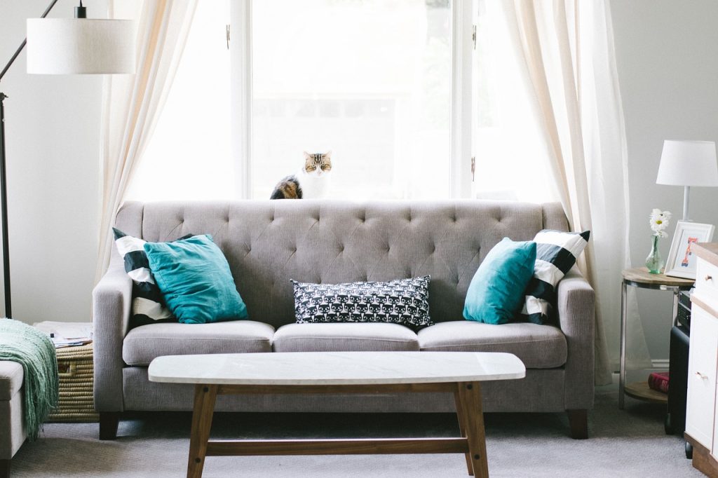 Open the curtains or blinds to let light in to make a small room look bigger