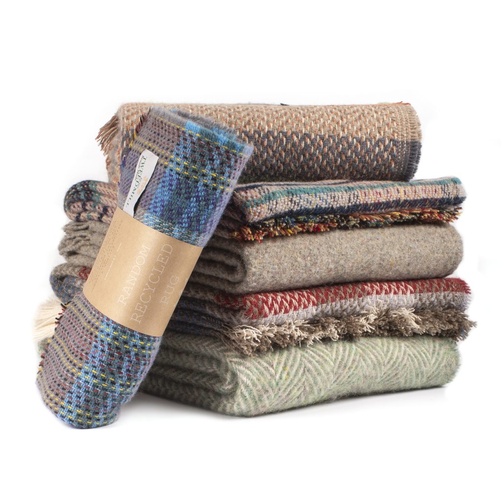 a stack of random recycled throws from tweedmill